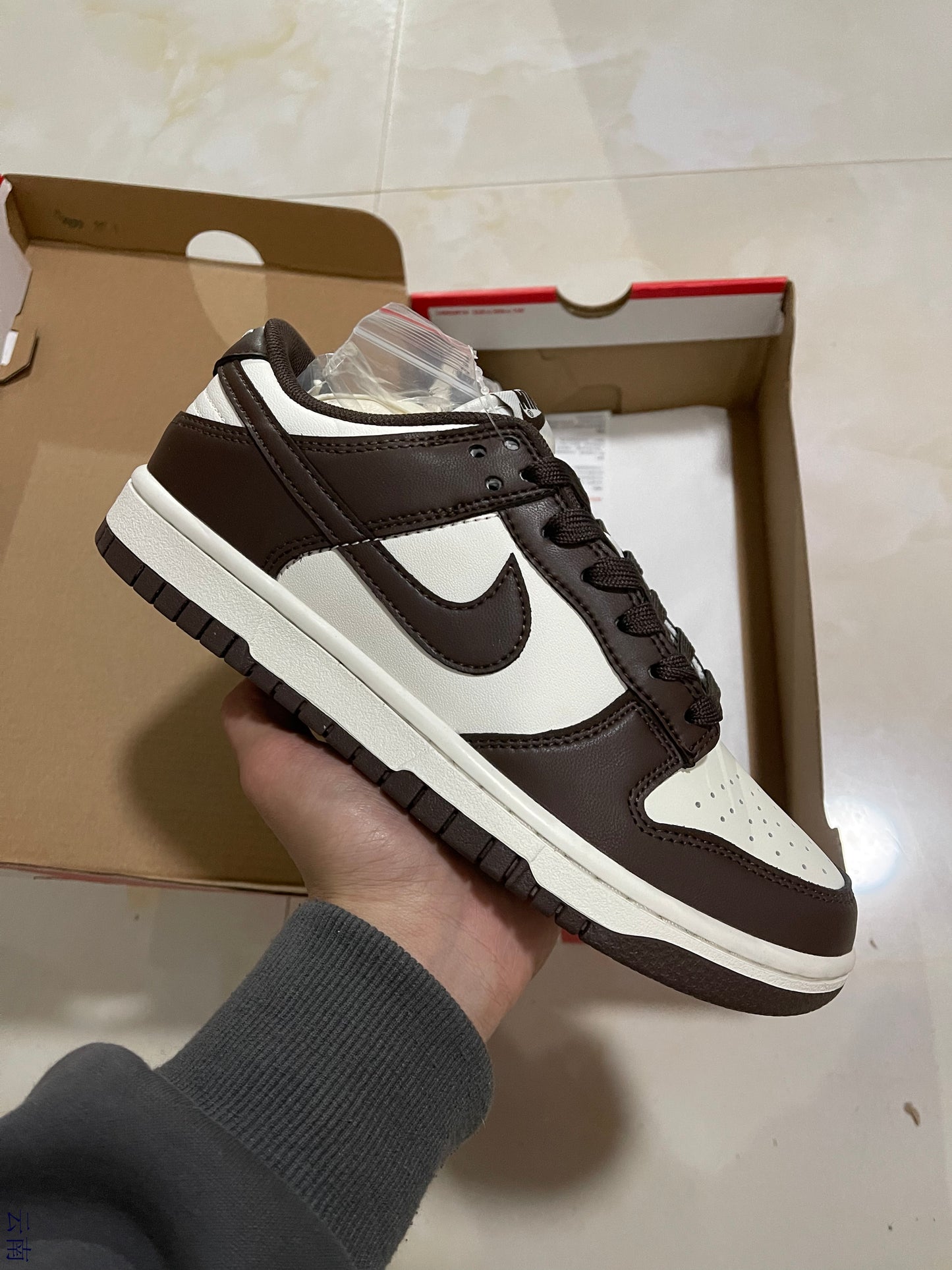 A Nike SB Dunk - Surfaces in Brown