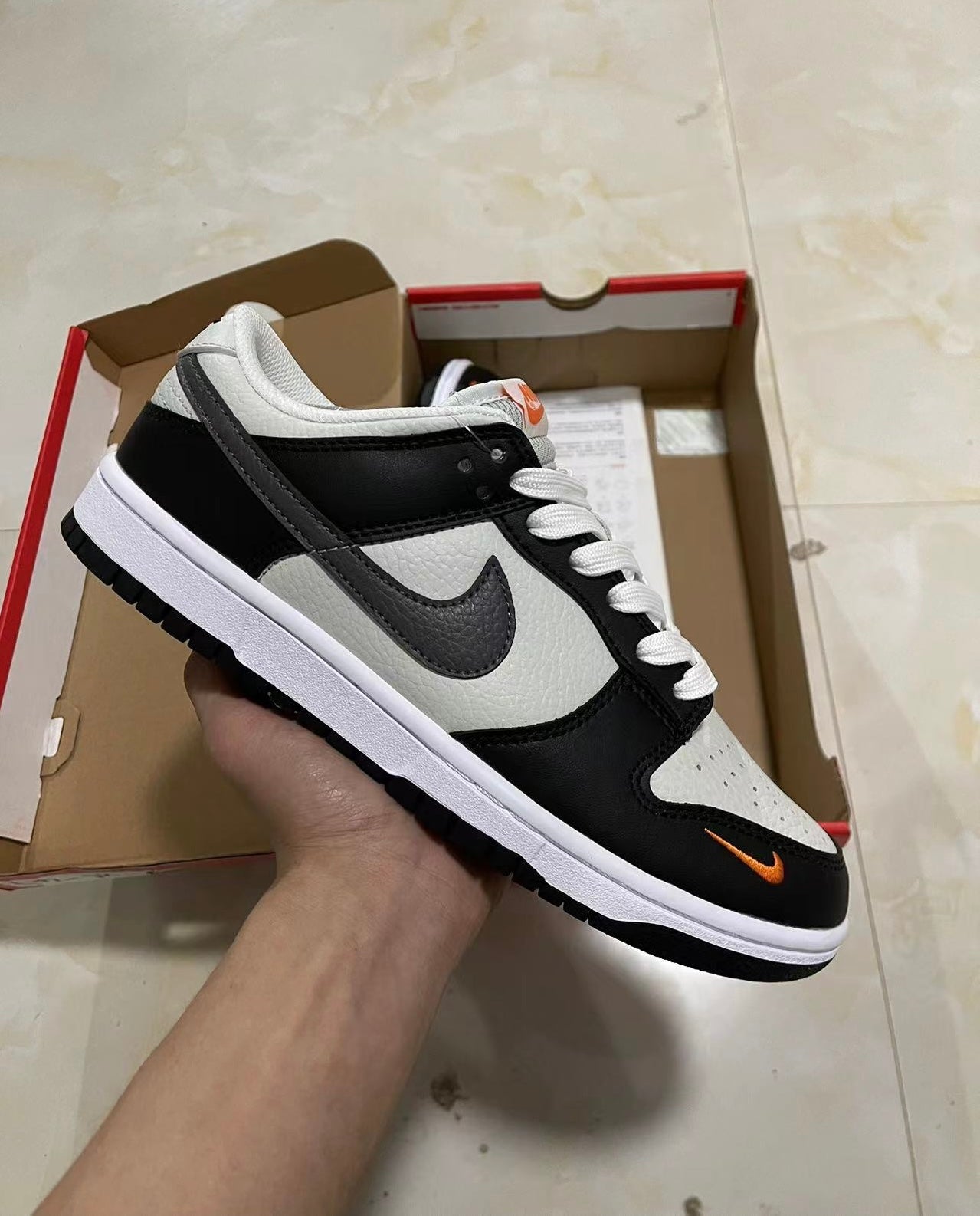 A Nike SB Dunk- Bright Mandarin mini Swoosh