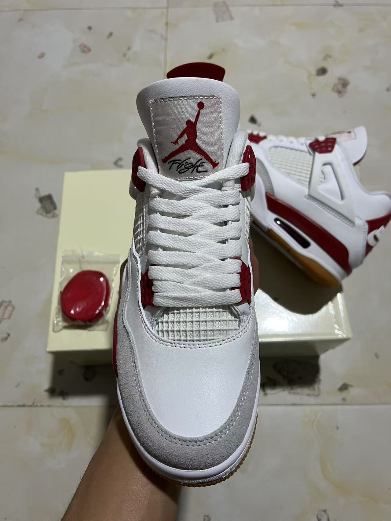 A Nike SB x Jordan 4- Varsity Red