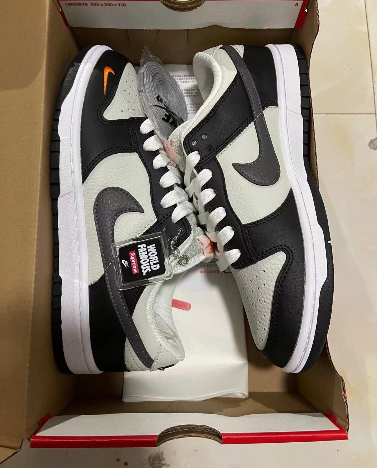 A Nike SB Dunk- Bright Mandarin mini Swoosh
