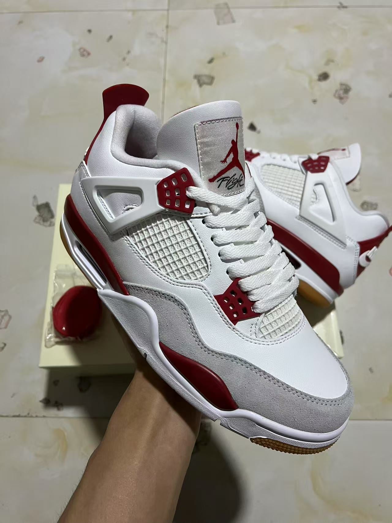 A Nike SB x Jordan 4- Varsity Red