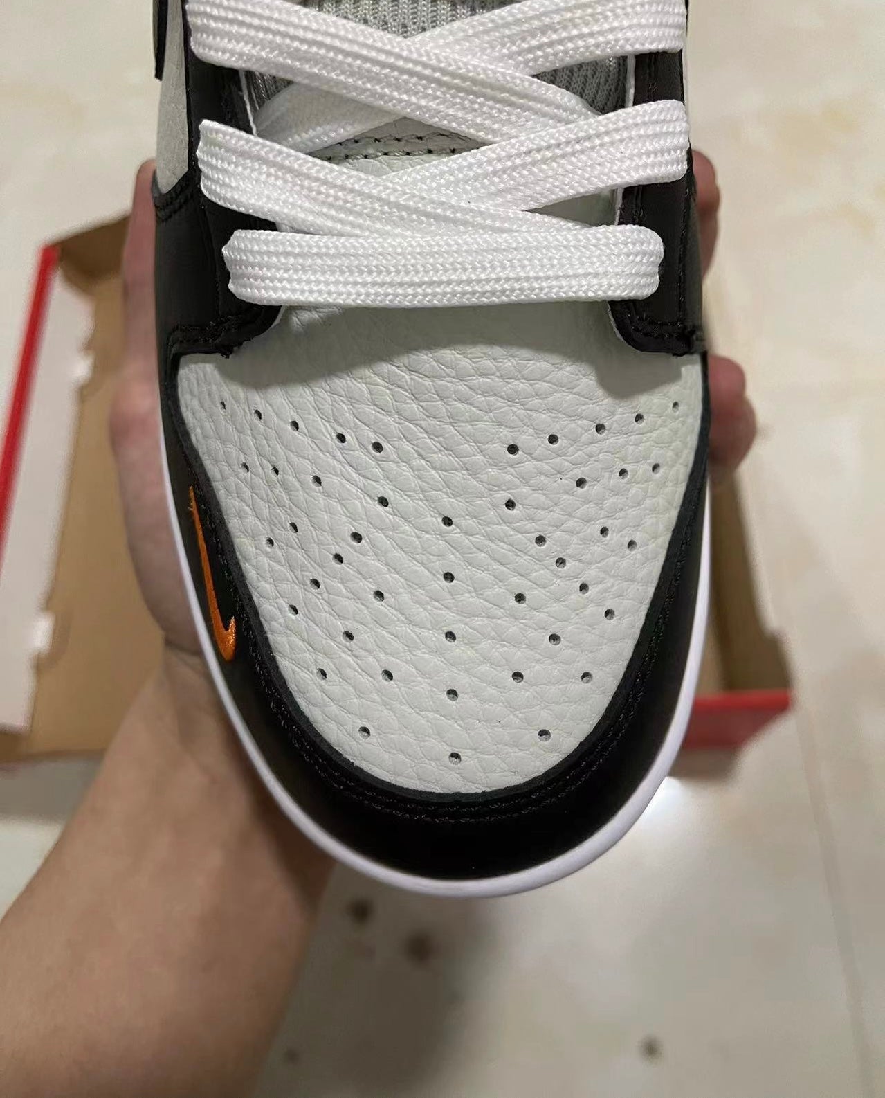 A Nike SB Dunk- Bright Mandarin mini Swoosh