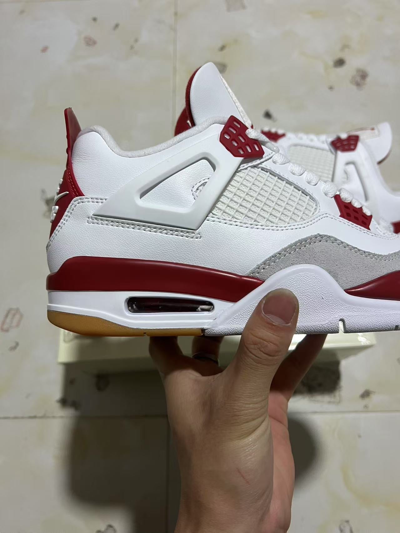 A Nike SB x Jordan 4- Varsity Red