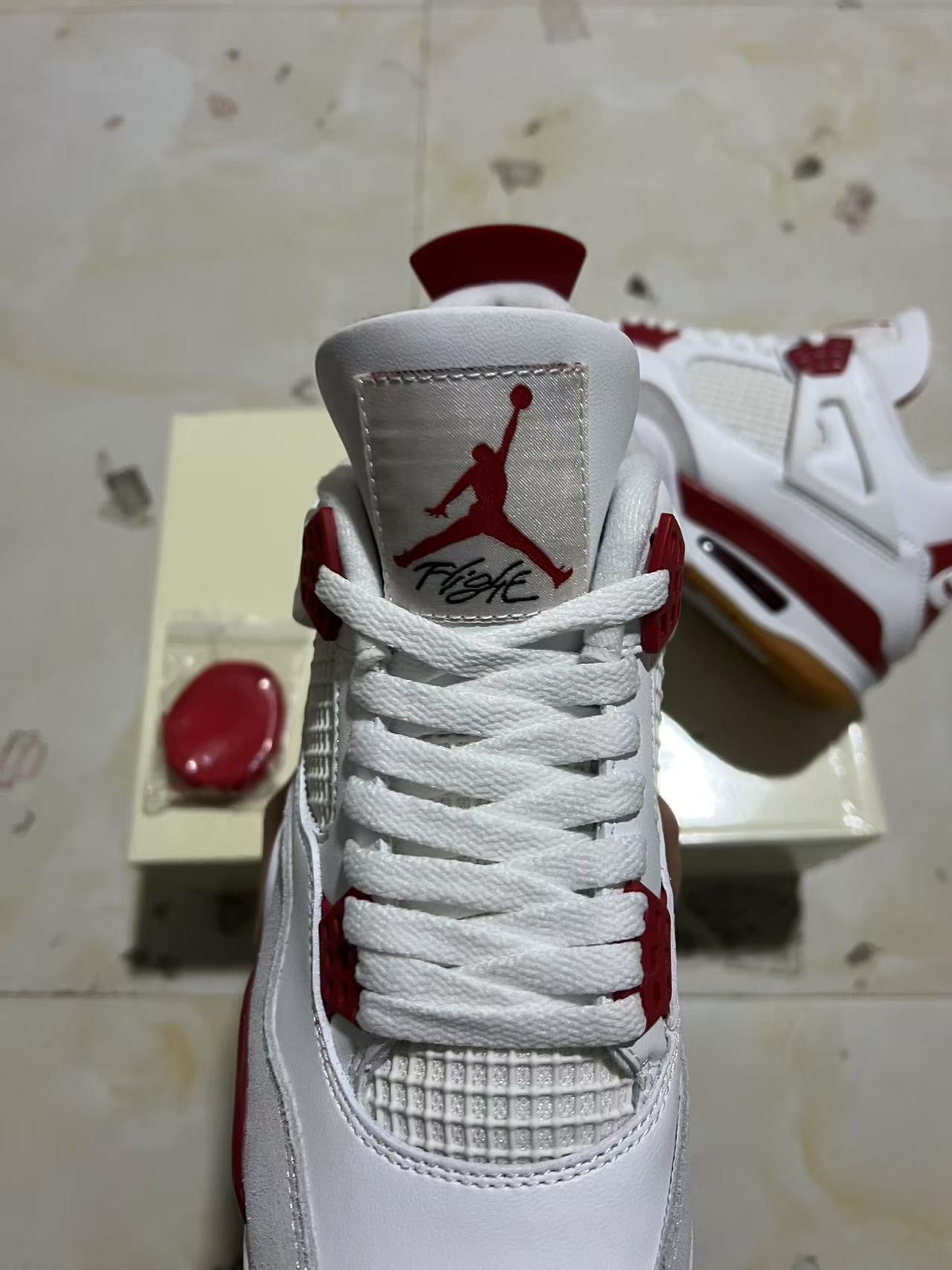 A Nike SB x Jordan 4- Varsity Red