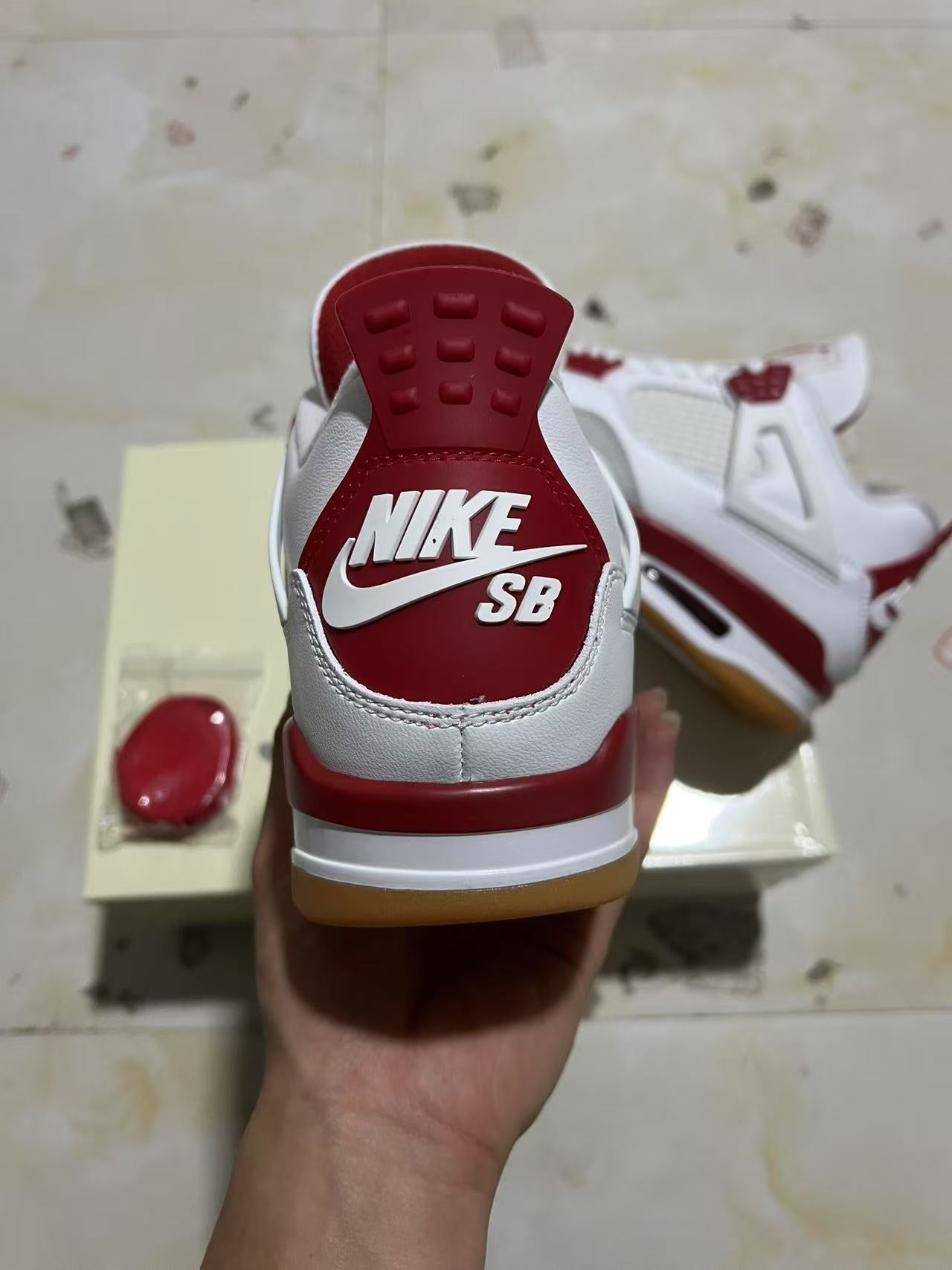 A Nike SB x Jordan 4- Varsity Red