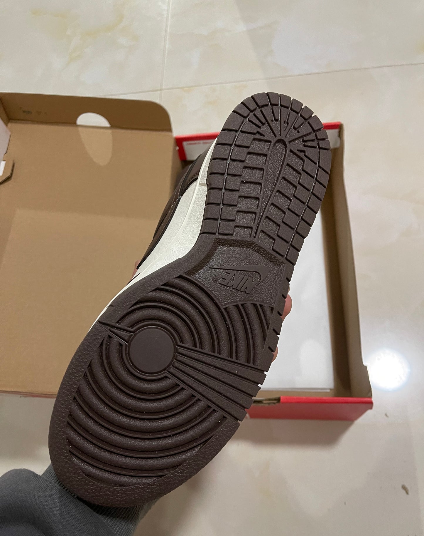 A Nike SB Dunk - Surfaces in Brown