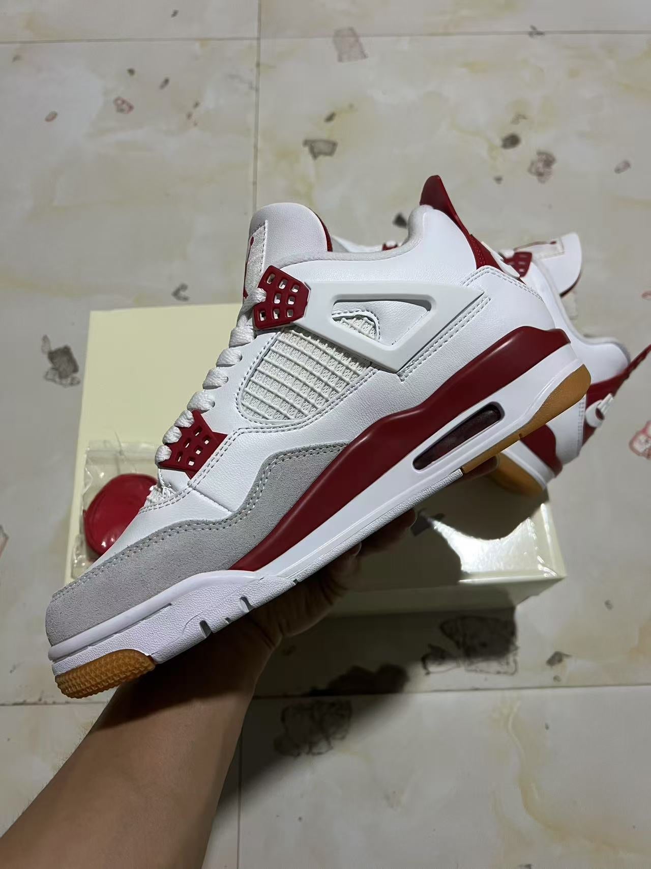 A Nike SB x Jordan 4- Varsity Red