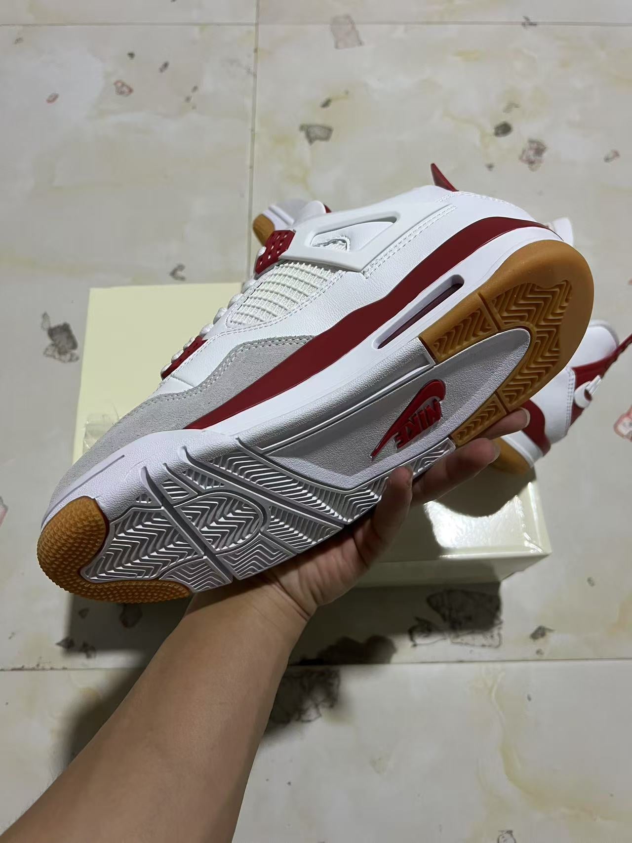 A Nike SB x Jordan 4- Varsity Red