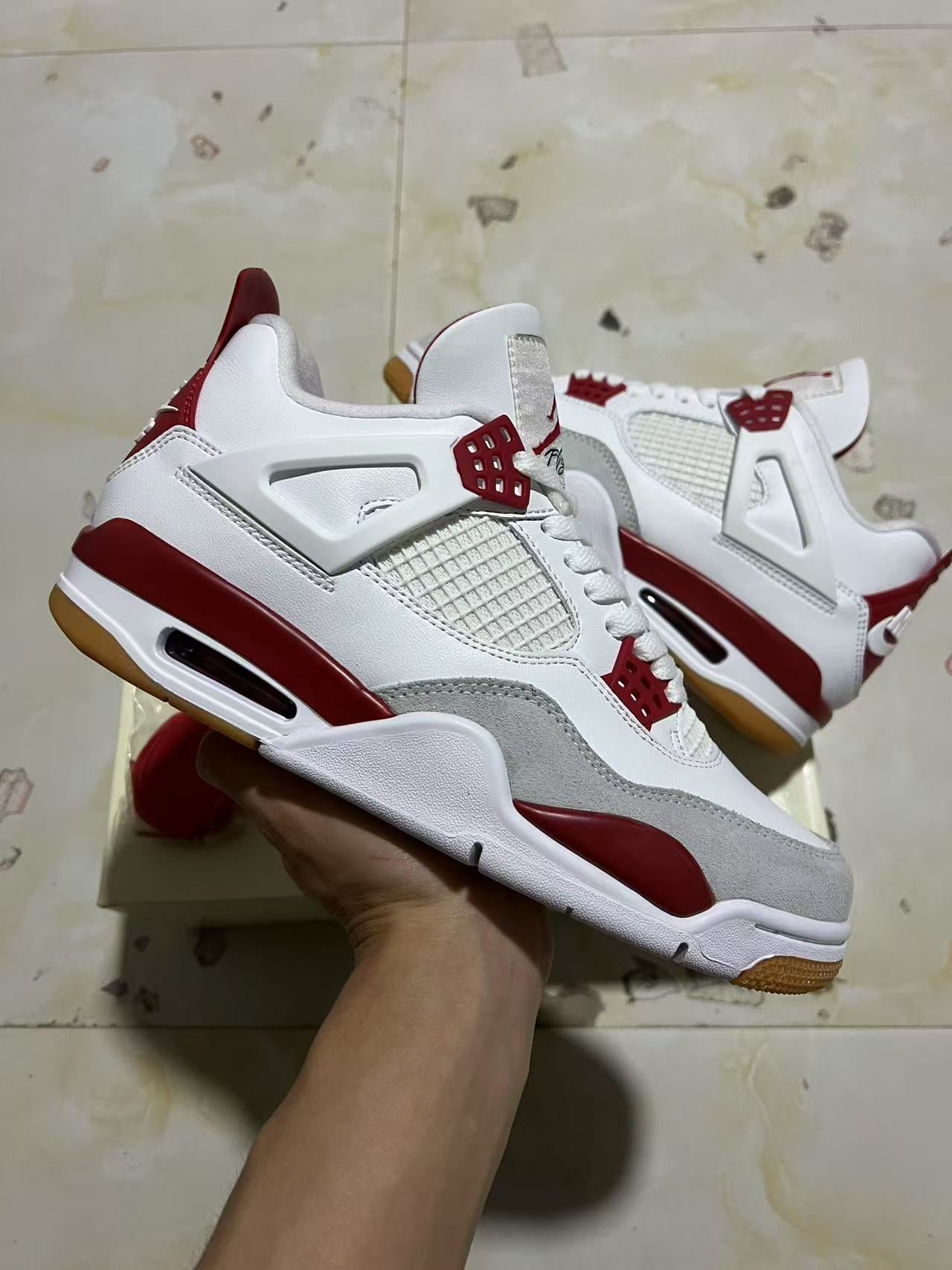 A Nike SB x Jordan 4- Varsity Red